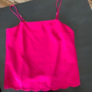 A vibrant raspberry colored silk/polyester camisole